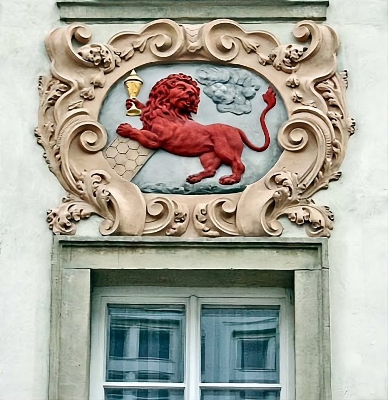 House sign showing the red lion and a chalice. magic bohemia tarot of prague