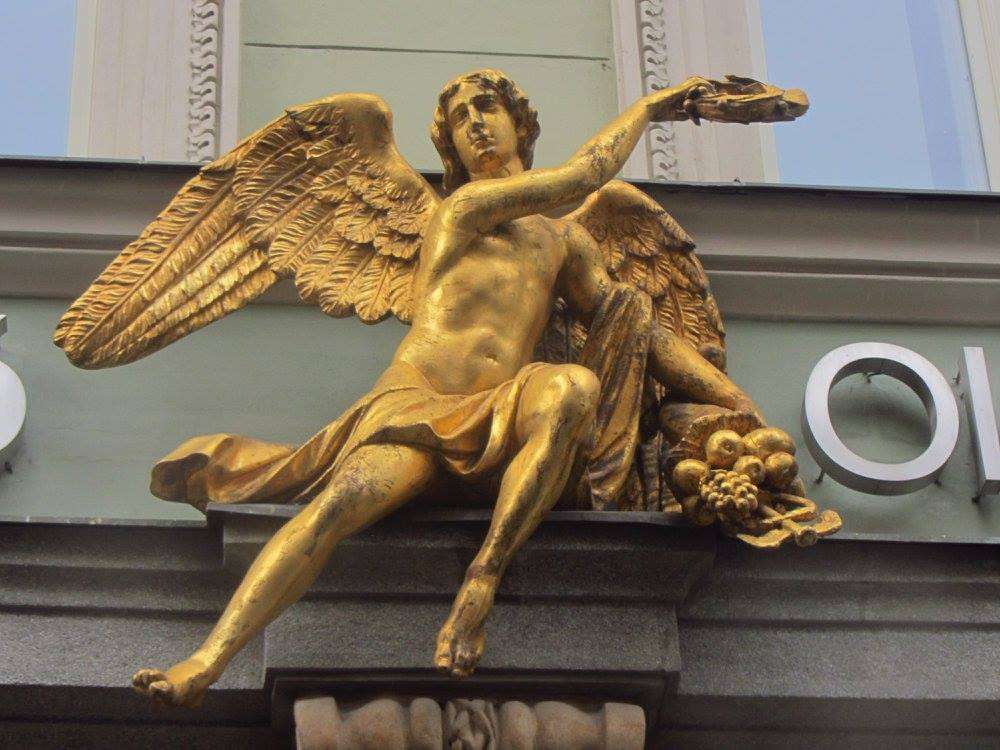 Winged Mercury (or and angel) with a cornucopia and caduceus