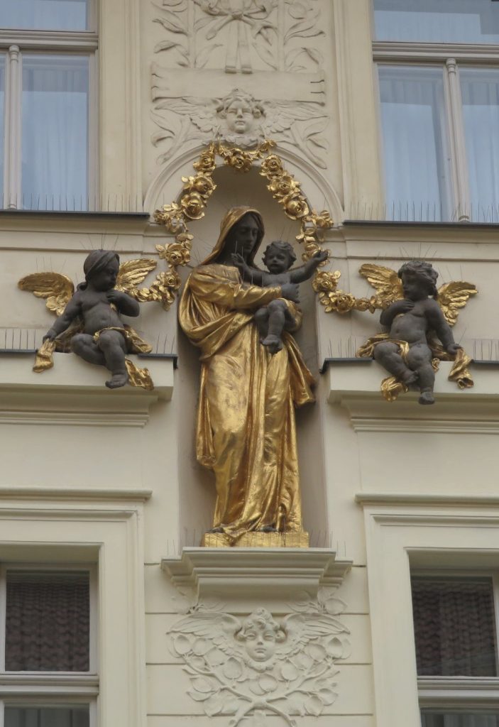Madonna statue over a doorway on Truhlářská Street